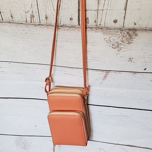 Malibu Skye women's vinyl crossbody bag with three zippered compartments peach